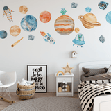 Kids' bedroom featuring colorful space-themed wall decals, including planets, rockets, astronauts, and aliens, adding a playful and educational touch