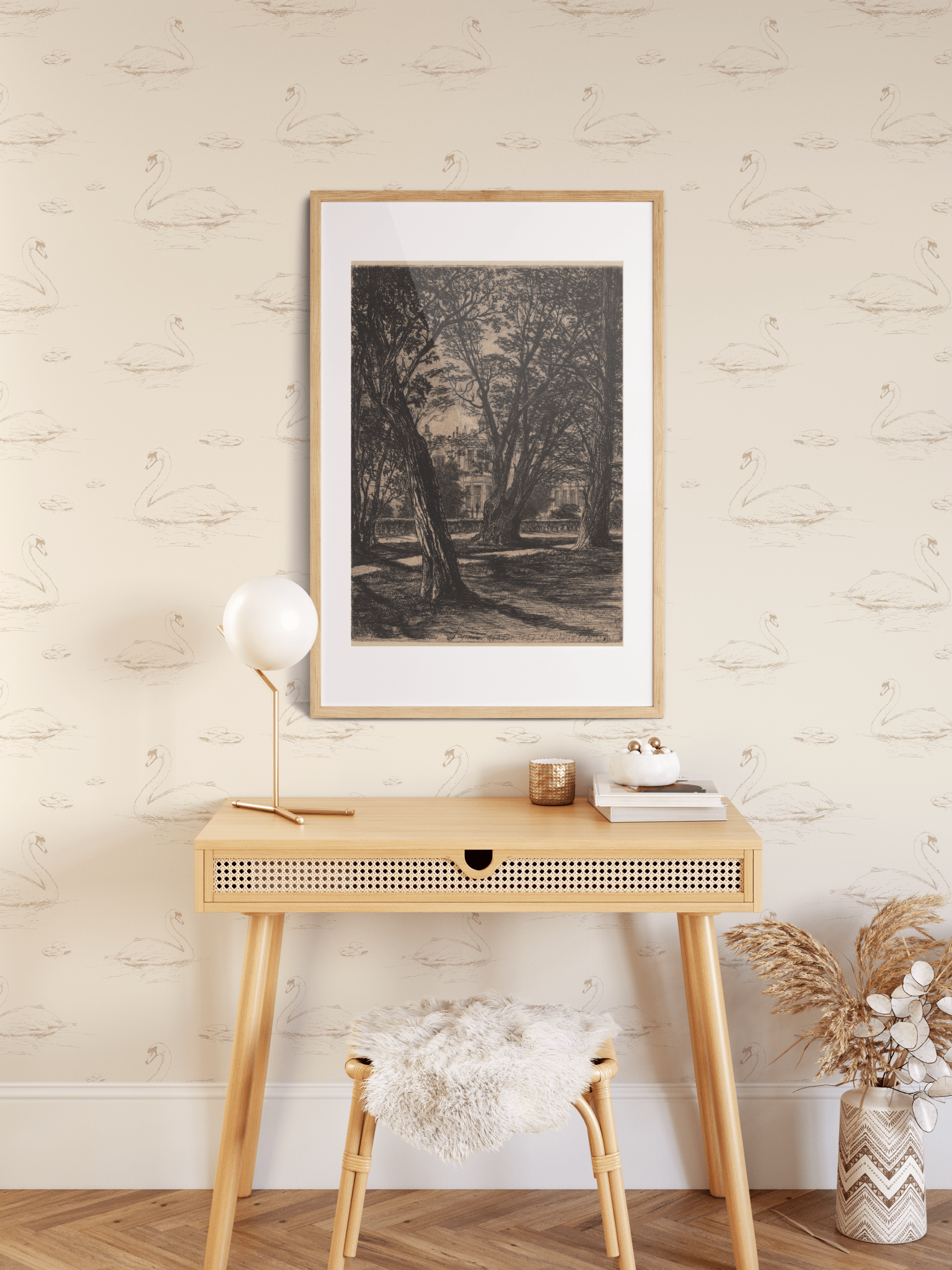 A stylish console table against a wall decorated with swan wallpaper, featuring a framed art piece, a modern lamp, and decorative items, along with a cozy stool and a vase of dried flowers