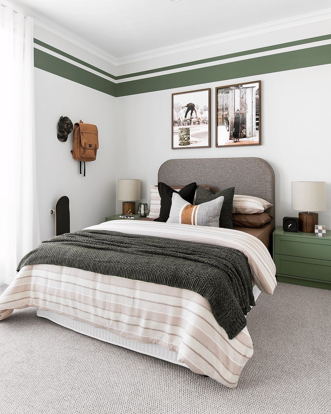 Modern bedroom with green and white thick and thin stripe wall border decals, creating a stylish accent around the room.