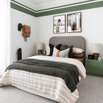 Modern bedroom with green and white thick and thin stripe wall border decals, creating a stylish accent around the room.