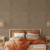 Warm and cozy bedroom with boho-style decor and Brown Tuscany Limewash Wallpaper