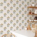 Yellow block print floral wallpaper adorning a cozy kitchen wall with floating shelves and farmhouse decor.