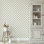 Farmhouse-style kitchen with yellow floral wallpaper and rustic wooden cabinets.