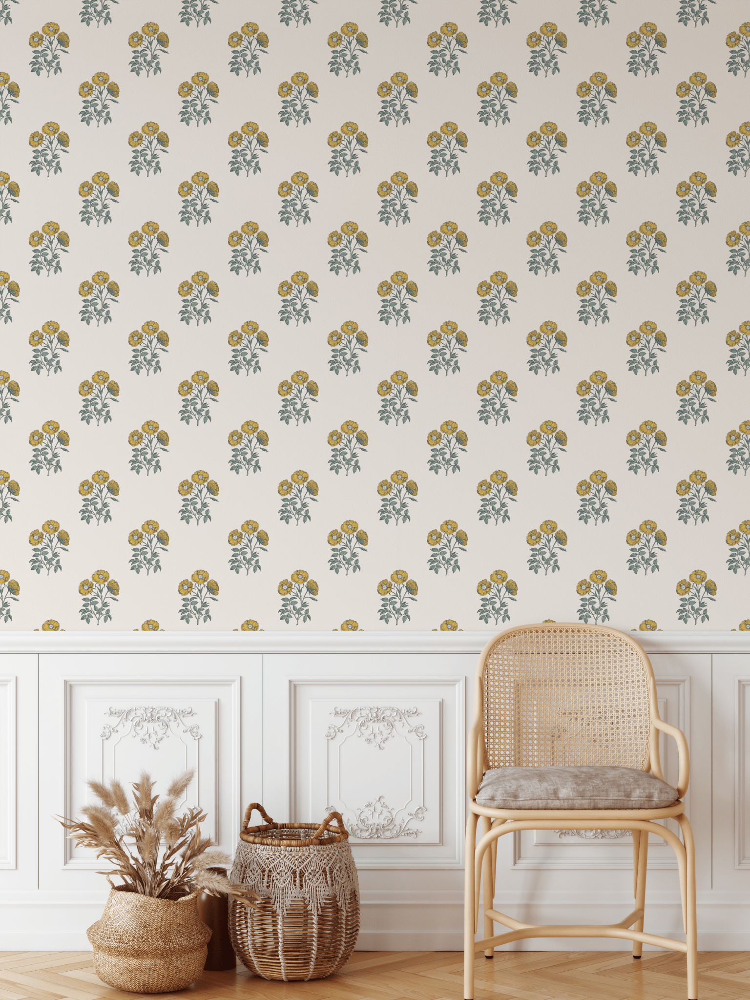 Vintage yellow floral block print wallpaper in a rustic living room with white wainscoting and a rattan chair.