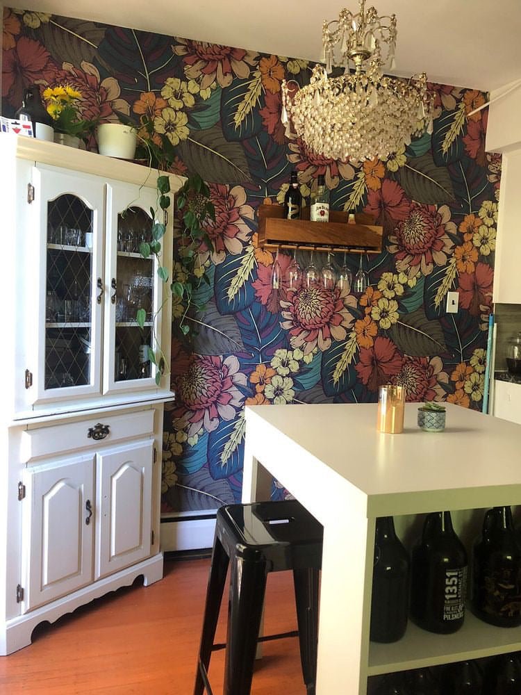 Aloha Dreams removable wallpaper tropical pattern floral wallpaper for the home in a kitchen with a white table and cabinet