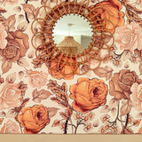 Bohemian orange, brown and cream wallpaper with decorative bamboo mirror.