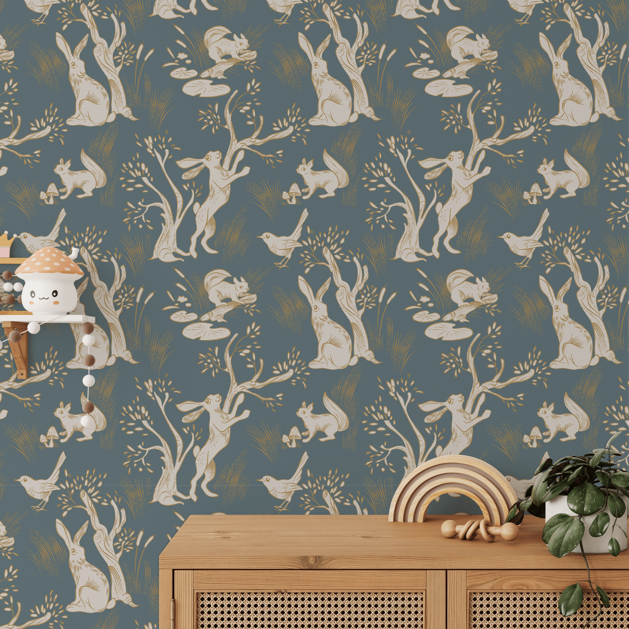 A whimsical children's room featuring a wallpaper with a repetitive pattern of white rabbits in various poses amongst trees and foliage on a blue background. 