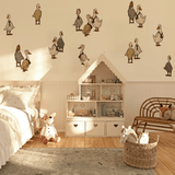 An assortment of playful duck and goose wall decals adorning the walls of a children's bedroom with a cozy bed, a dollhouse-style bookcase, and a woven basket filled with plush toys on a patterned rug