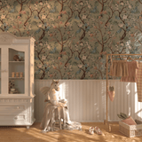 Cozy nursery corner with a playful ambiance, highlighted by Chinoiserie wallpaper with soft pink flowers on branches, creating a warm, vintage feel.