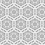 Close-up of a peel and stick wallpaper sample showing a black and white geometric hexagon pattern with intricate details, offering a modern and bold design for wall decor.
