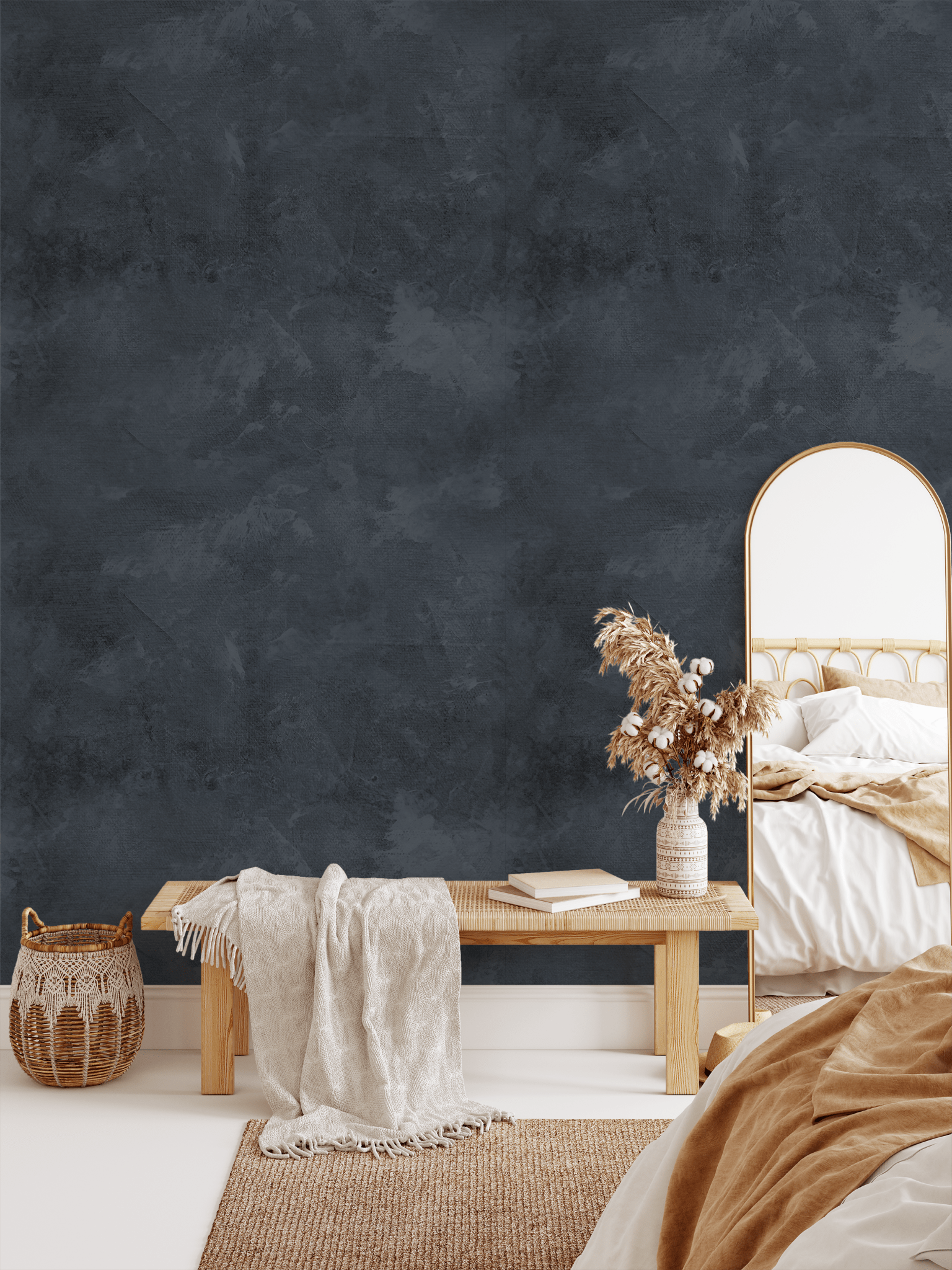 Bedroom with high-quality ink blue limewash wallpaper, gold-framed mirror, and rustic decor.