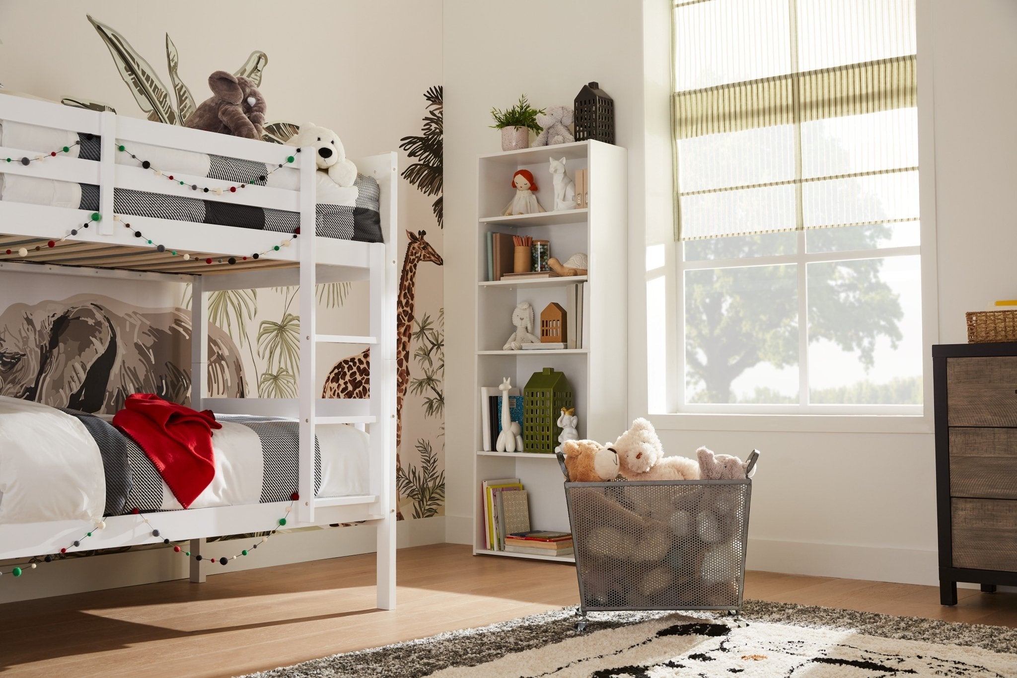 Child's bedroom with white bunk beds and aesthetic safari wallpaper