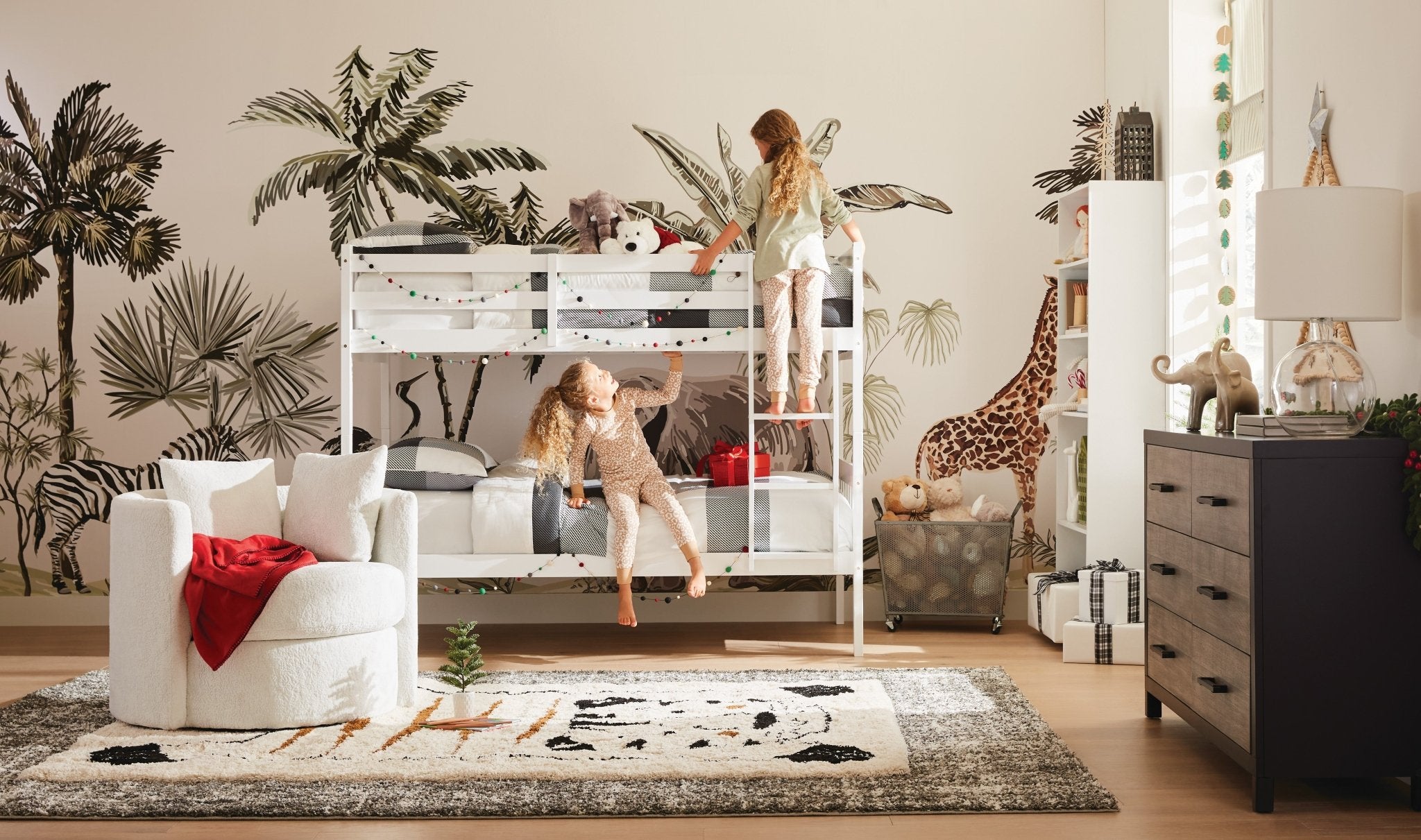 Safari Animal zebra, giraffe, elephant wall decor in a room with white bunk beds