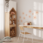 Child's art desk with large daisy wall stickers