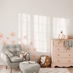 Child's nursery room with soft accents and large daisy wall stickers