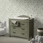Child-friendly peel and stick wallpaper in a soothing green palette, adorned with playful rabbits and foliage, setting a calming and imaginative backdrop in a nursery room with a changing table and plush toys