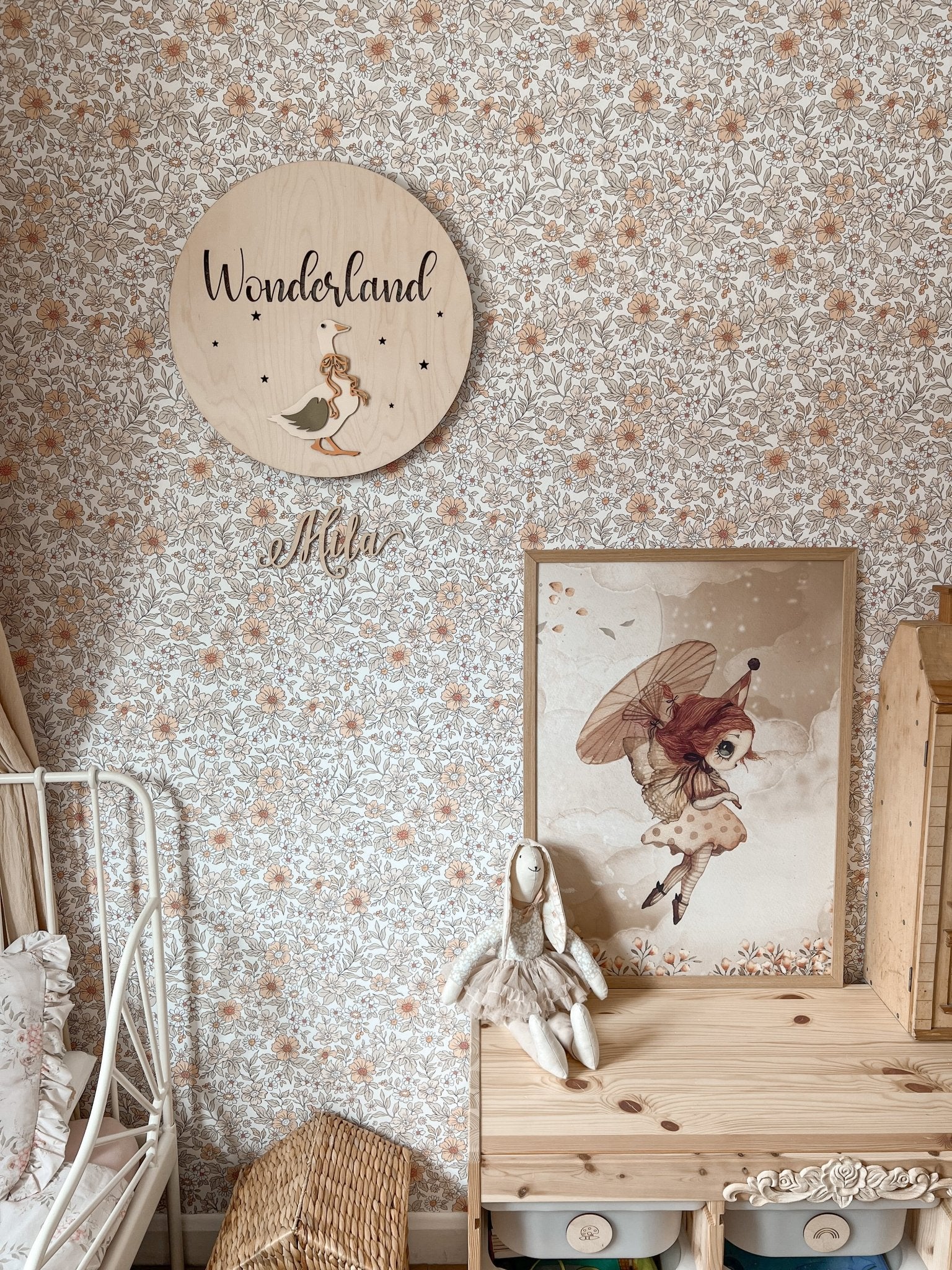 Neutral tone flower wallpaper, matches beautifully with natural wood decor in a children's room
