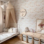 Beautiful girl room with natural tones and orange minimal floral wallpaper