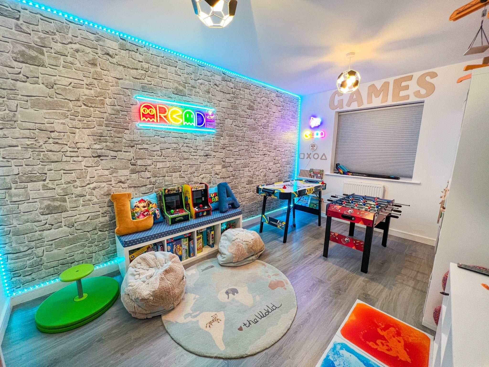 Kids arcade room with peel and stick stone brick wallpaper